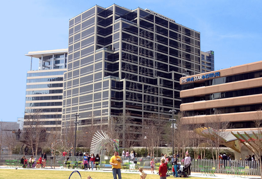 This office building sits on a one-acre city block adjacent to Klyde Warren Park in Downtown Dallas. Because of site restrictions, the office building lives on top of the parking garage--creating a taller building with greater presence along Woodall Rodgers Freeway, and maximizing views for the office space (the lowest office level is nine floors up). OMNIPLAN proudly officed on the 15th floor for 19 years and then moved to the 16th floor in 2020. 